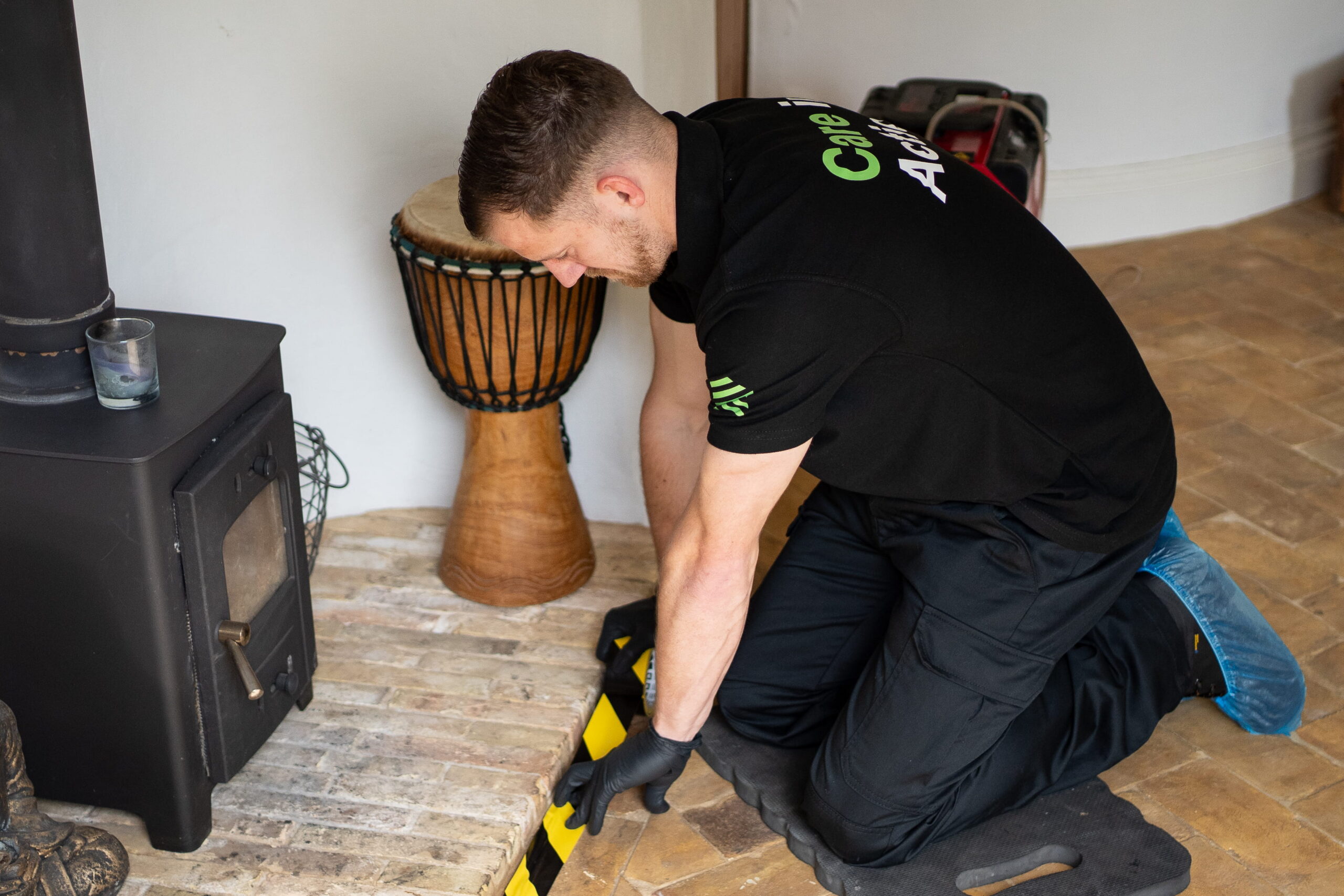 Disaster Care Mould Remediation Specialist Setting Up Containment in a Residential Property 