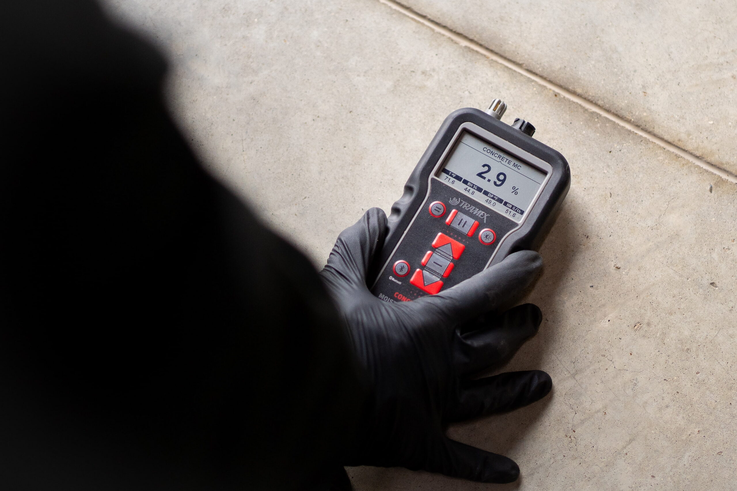 Disaster Care technician carrying out water damage assessment in a residential property 