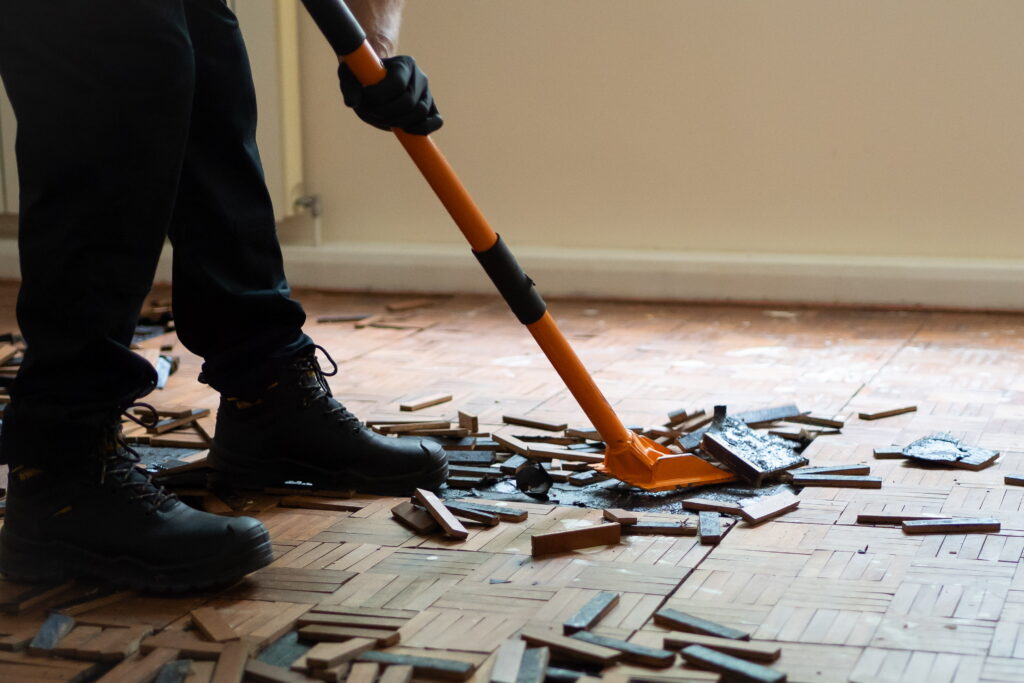 Disaster care technician completing strip out during building restoration and reinstatement 