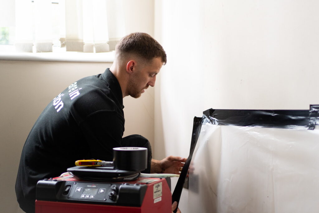 Technician Completing Water Damage Restoration | Disaster Care