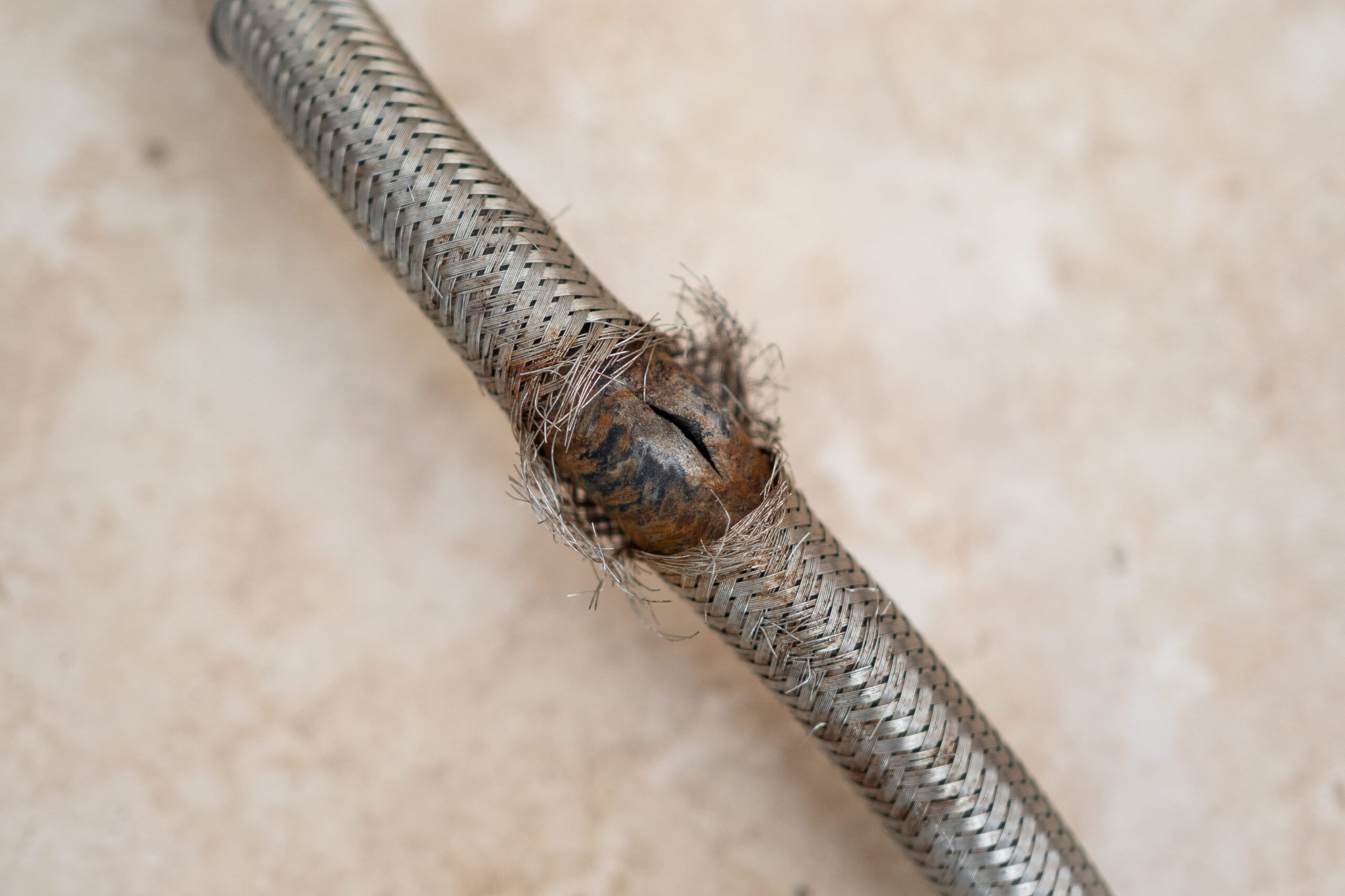 Disaster Care technician using borescope camera to inspect pipework during leak detection 